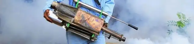 Fumigation technician using a fogger for deep pest treatment in Norfolk, VA